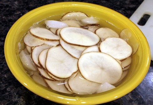 Sliced Potatoes in Ice Bath